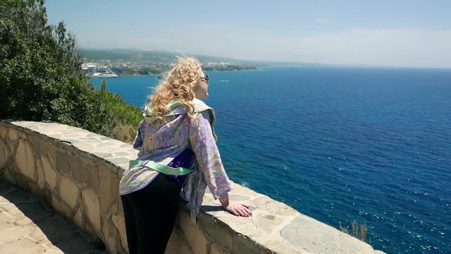 Cute woman in sunglasses, european romantic lady female tourist resting near sea. Tourism, travel journey trip voyage, recreation, relaxation, vacation in holiday