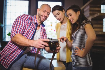Business people smiling while looking at camera 