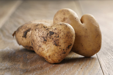 heart shaped potatoes on oak table