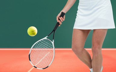 Composite image of athlete playing tennis with a racket 