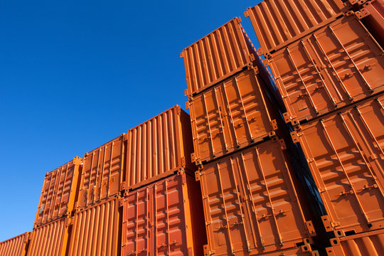 Stacks of orange shipping containers