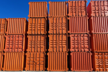 Stacks of orange shipping containers