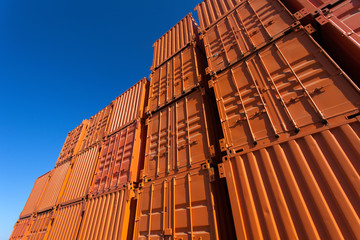 Stacks of orange shipping containers