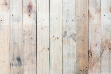 Grunge brown wood  wall background with knots and nail holes