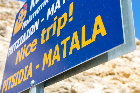 Town sign from Pitsidia and Matala on the road at the entry to Matala. Both villages are one municipality.  Matala, more touristy, is known for his famous caves and the hippies in the 70s