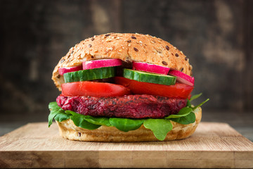 Veggie beet burger on rustic wooden table