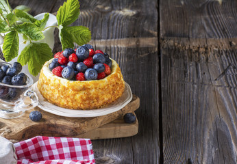 beautiful cheesecake with blueberries and strawberries