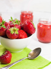 Fresh strawberries in a white bowl