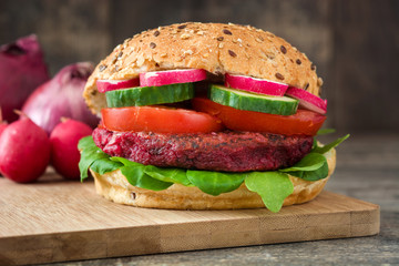 Veggie beet burger on rustic wooden table
