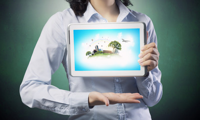 Woman use tablet device . Mixed media