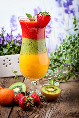 Smoothies with fresh fruit. Strawberries, apricots, kiwi.