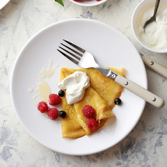 breakfast crepe with raspberry and cream