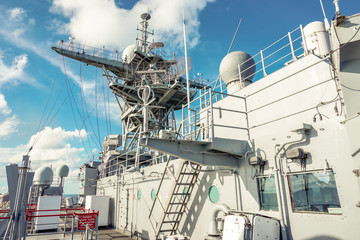 a mast and upper deck of navy ship