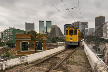 Iconic Santa Teresa tram is passing Carioca Aqueduct