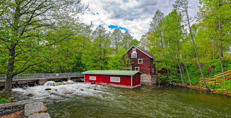 Rapids and water mill museum dam in Vaaksynjoki