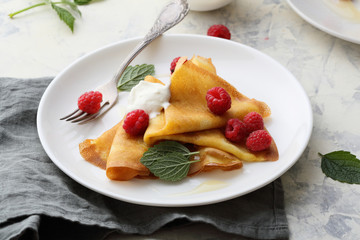 summer crepes with cream and berries