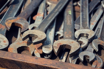 Loads of wrenches or spanners in a wooden drawer