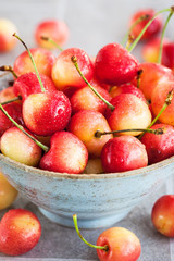 Bowl of fresh wet pink cherry