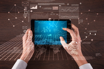 Business hands holding tablet