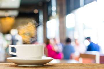 Hot coffee on blur people in coffee shop