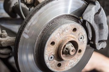 Dirty old used disc brake changing