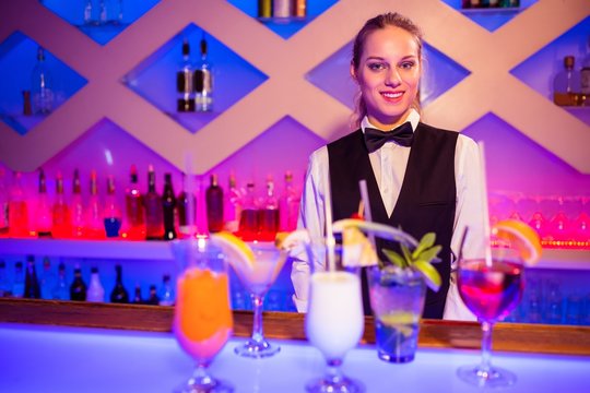 Portrait Of Smiling Barmaid Standing