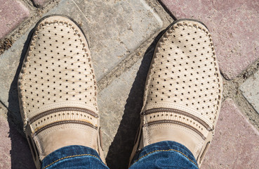 Moccasins on his feet