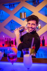 Handsome bartender preparing cocktail 