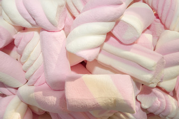 Pink and white marshmallows close up view.
