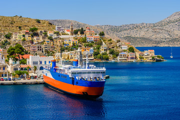 the scenic waterfront with colourful houses of Symi island, Dodecanese, Greece.