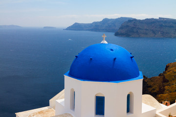Fototapeta premium view of caldera with blue domes, Santorini