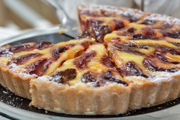 Freshly baked plum pie in organic bakery