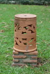 Naklejka premium Baked Clay Lamp In The Garden