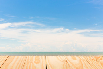 Wood table top on tropical beach and sky background