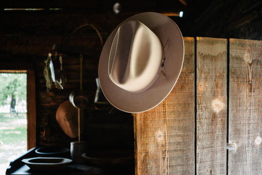 Cowboy hat hanging on open door