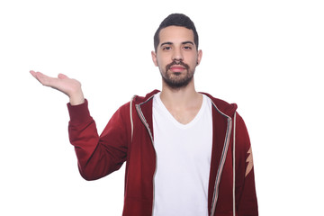 Young latin man holding something on the palm.