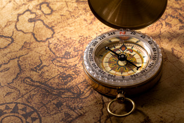Vintage compass on map.