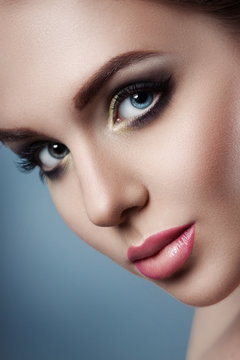 The girl's face close up. Beauty stock photos. Perfect skin, beautiful professional makeup