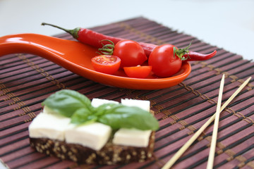 Fresh cherry tomatoes and kalamata olives on toast.