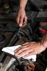 Hand with wrench close up
