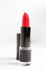 Red lipstick on white background