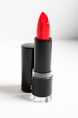 Obraz premium Red lipstick on white background