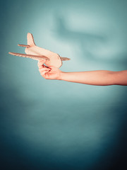 Woman holding airplane in hand.