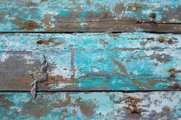 texture: old wooden planks with chipping turquoise paint