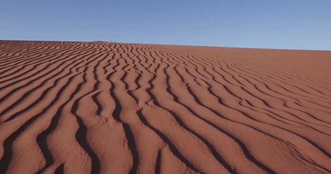 4K close-up moving shot of ripples in the surface of a sand dune inside the Namib-Naukluft National Park 