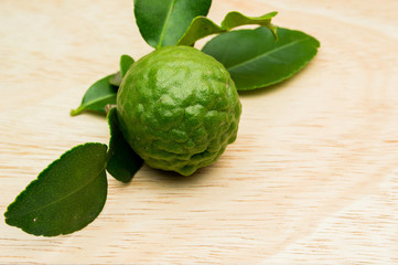 kaffir lime on a wooden background.
