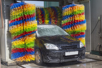 car wash brushes, colorful, foam, black car