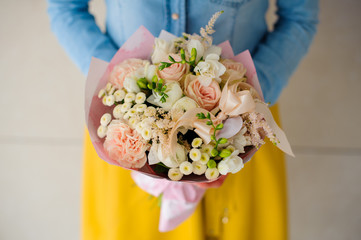 girl holding a bouquet of white flowers