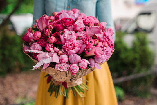 Girl Holding A Bouquet Of Pink Flowers
