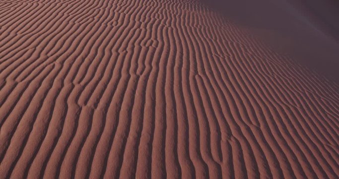 4K close-up panning shot of ripples in the sand dunes inside the Namib-Naukluft National Park